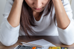 woman with credit card bills