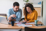 Young couple reviewing finances